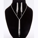 This silvertone and clear rhinestone tassel 13.38in necklace with 4in ext and 4.5in drop and 3in earrings