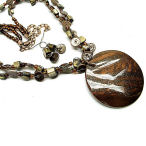 Big and brown with lots of shine this 18 inch necklace with 2 inch drop and earring set is a must have