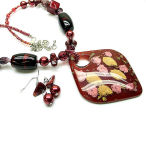 This red and gold necklace set is big and beautiful 20 inch long with 3 inch drop