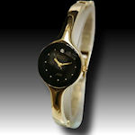 Armitron stylish gold band with a black provocative face with a diamond  $45