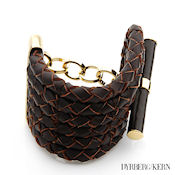 8250 $115 Dyrberg-Kern Maelee collection Brown leather and Gold plate 104g, 54mm wide 8mm high Toggle clasp MSRP $439